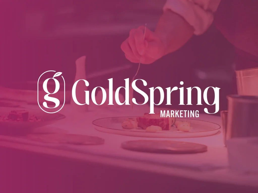 GoldSpring Marketing logo in white, a custom "g" monogram with a sprouting leaf beside the GoldSpring wordmark, over a magenta-tinted photo of a chef plating food.