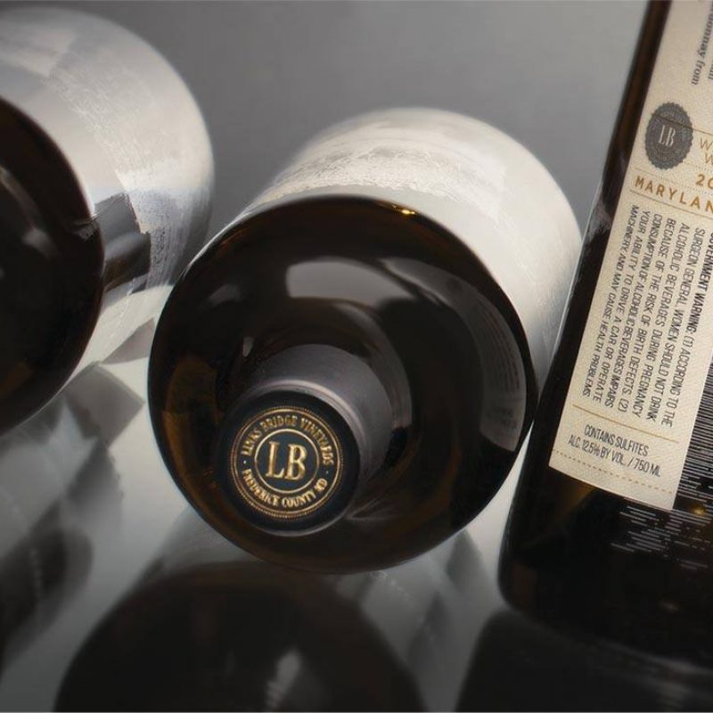 Wine Label Design: Sophisticated wine bottle label design for Links Bridge Vineyards, showcasing minimalist and elegant branding.