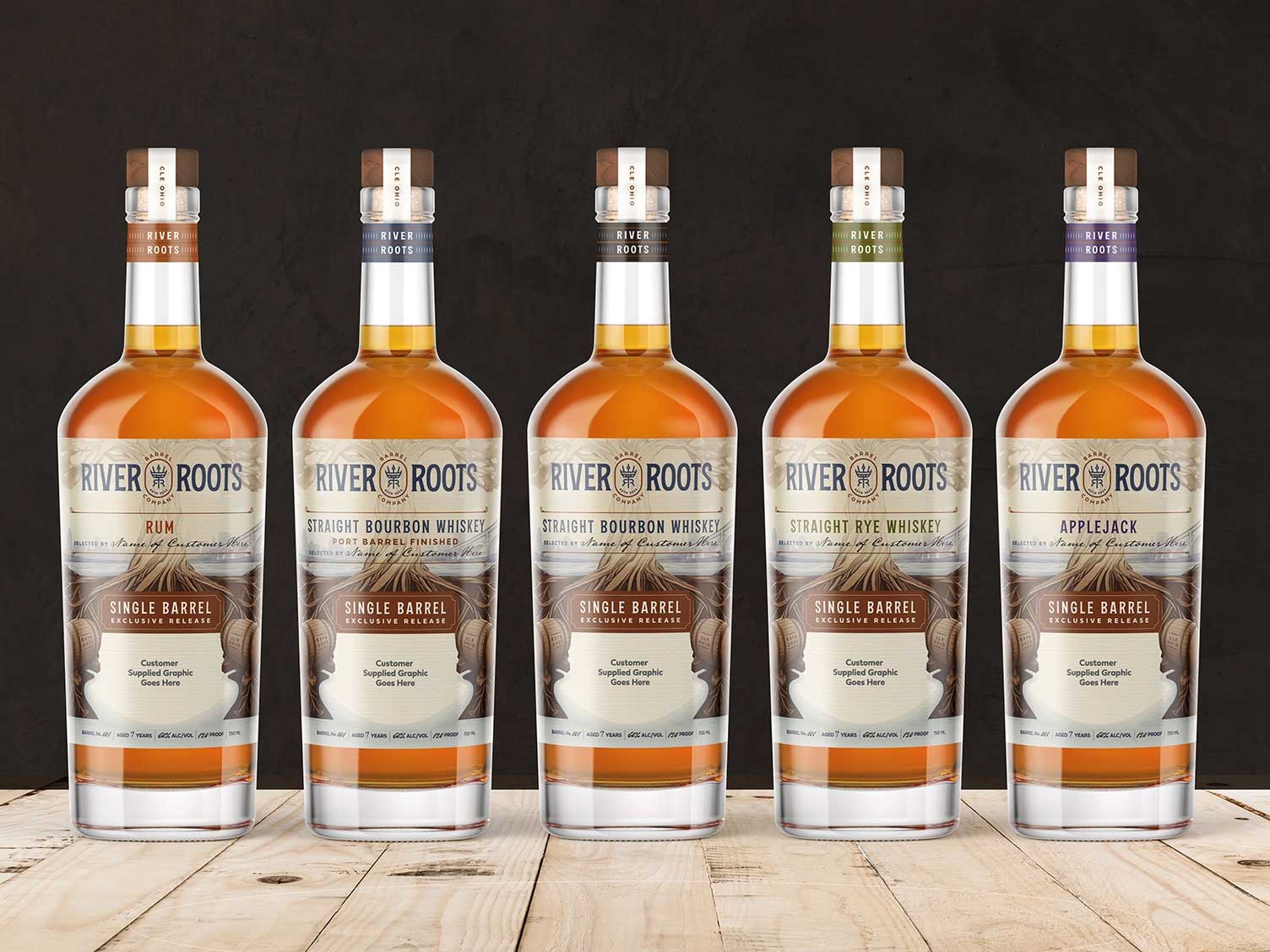 Five whiskey bottles showcasing custom label design